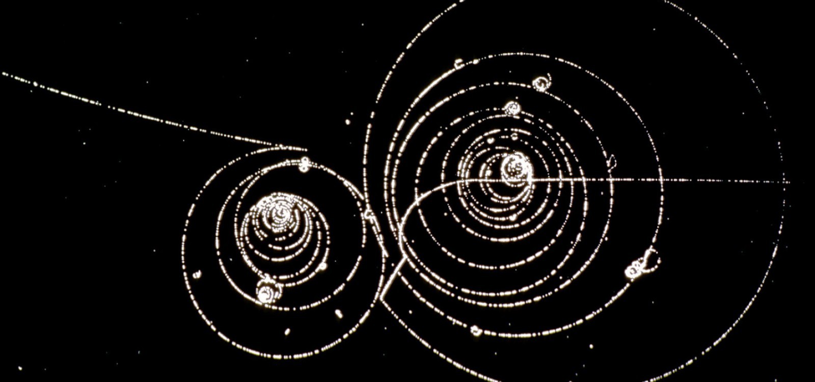 Image of one CERN's bubble chambers that shows the decay of a positive kaon in flight. 