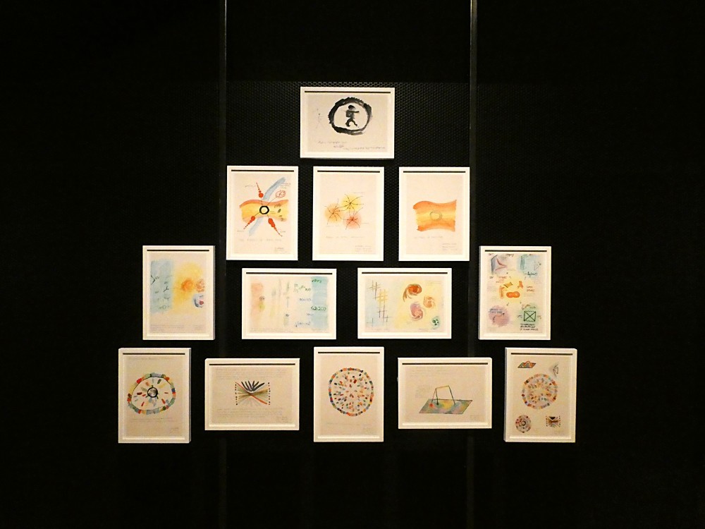 Suzanne Treister, The Holographic Universe Theory Of Art History (THUTOAH), 2018. 13 watercolours by CERN Theoretical Physicists, describing the holographic principle (each 21x29.7cm). Installation at FACT, Liverpool, UK 2018. Courtesy the artist.